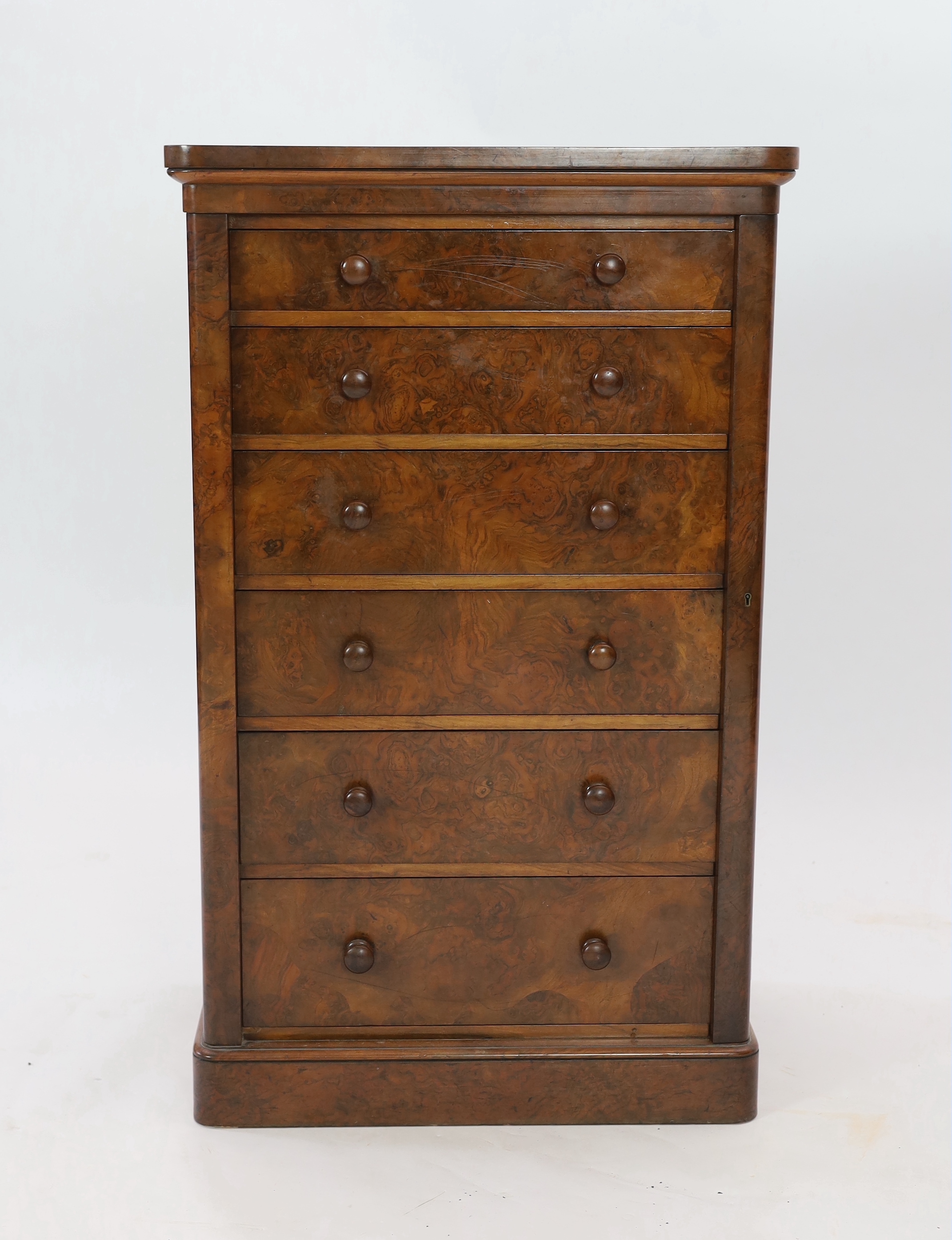 A Victorian walnut Wellington chest, retailed by Toplis & Son, Berners Street, London, width 62cm, depth 43cm, height 102cm